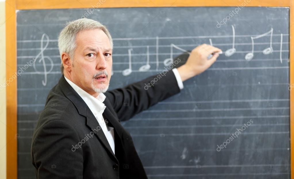 depositphotos_41491619-stock-photo-music-teacher-writing-notes-on